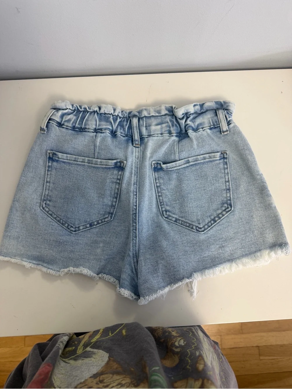 High-Rise Light Blue Paperbag Denim Shorts with Distressed Hem